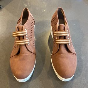 Women’s brown slip on shoes.